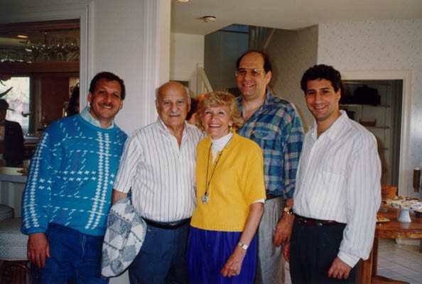 Lisa and Aron (center) with their three sons, Gordon, Howard, and Daniel. [LCID: derm38]