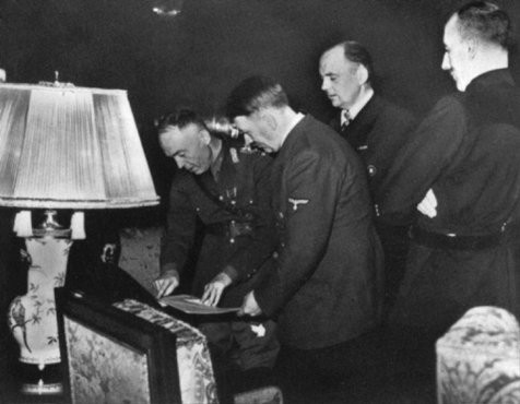 <p>In Hitler's presence, Romanian ruler Ion Antonescu signs the Three-Power Agreement. Berlin, Germany, November 23, 1940.</p>