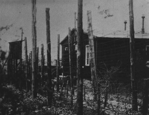 A view of the double row of barbed-wire fences that surrounded the Ohrdruf camp, a subcamp in the Buchenwald camp system. [LCID: 10278]