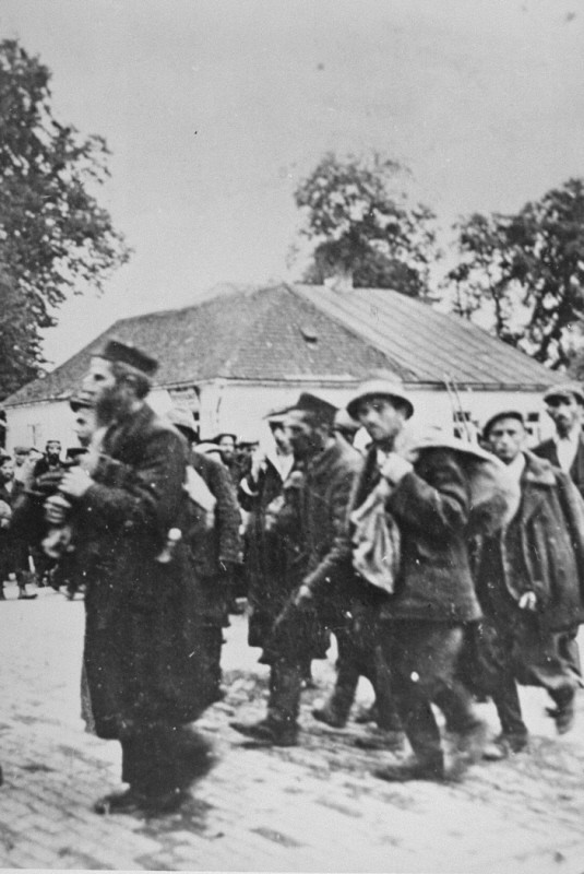 A column of prisoners arrives at the Belzec killing center.