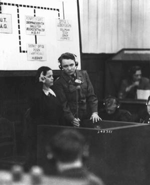 A Czech woman who witnessed the Nazi massacre of the male inhabitants of Lidice is sworn in at the RUSHA trial in Nuremberg. [LCID: 43021]