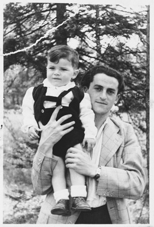 Josef Baldo, formerly a Bielski partisan, poses with his young son.