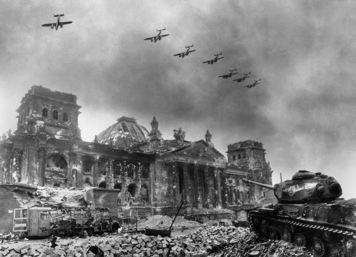 Soviet planes fly over the destroyed Reichstag building in Berlin.