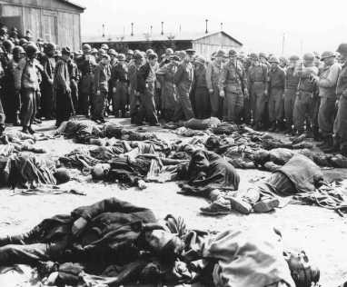 General Dwight D. Eisenhower (center), Supreme Allied Commander, views the corpses of inmates who perished at the Ohrdruf camp. [LCID: 23005]