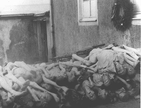 Corpses stacked behind the crematorium in Buchenwald. [LCID: 06668]
