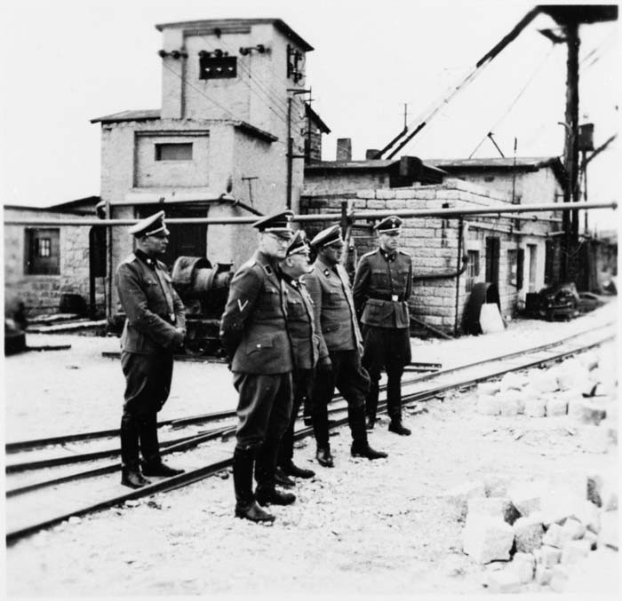 Commandant Arthur Roedl and SS officers visit the Gross-Rosen concentration camp's quarry.