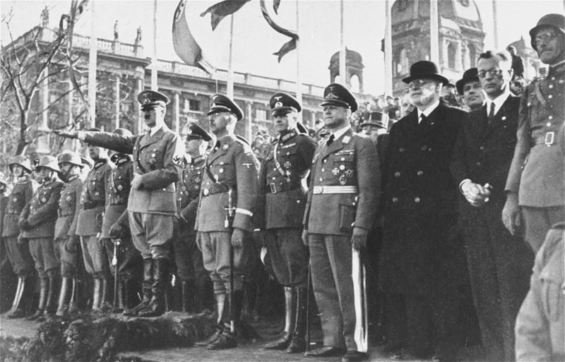 Adolf Hitler and his entourage view a military parade following the annexation of Austria (the Anschluss). Vienna, Austria, March 1938.