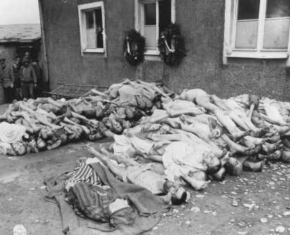 The bodies of former prisoners are stacked outside the crematorium in the newly liberated Buchenwald concentration camp. [LCID: 74608]