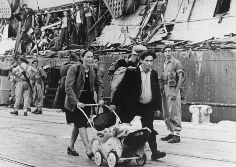 Refugees removed from the "Exodus 1947" walk to a ship which will return them to Europe. [LCID: 69941]