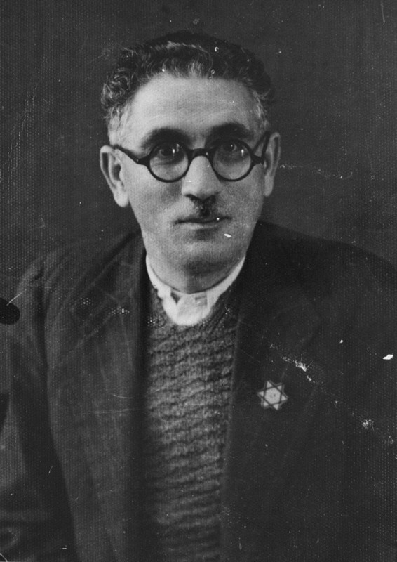 Joseph Levi, a pharmacist and the head of the Jewish community of Komotine, wearing the compulsory Jewish badge. [LCID: 79805]