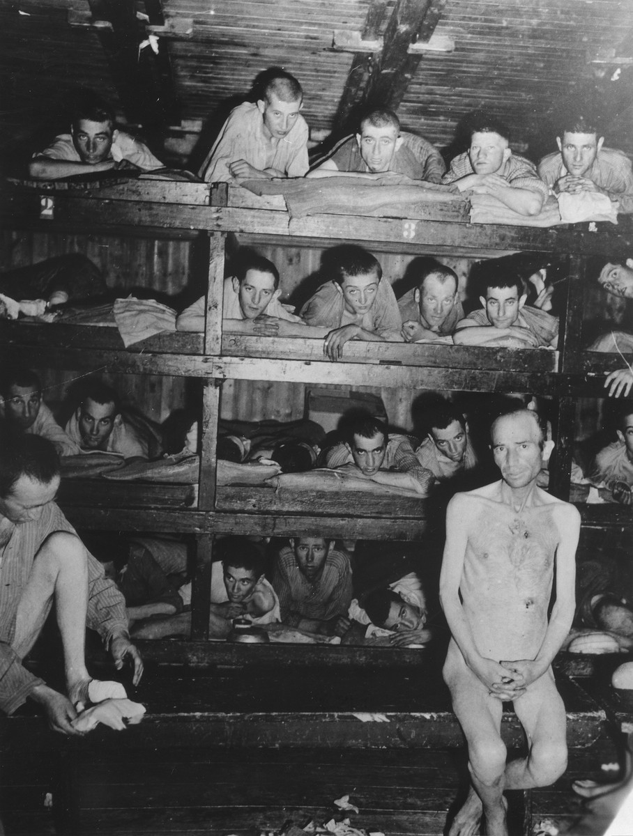 Liberated prisoners demonstrate the overcrowded conditions at the Buchenwald concentration camp, Germany, April 23, 1945. [LCID: 78713]