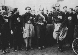 Italian Fascist leader Benito Mussolini (center) with aides and supporters. They are wearing the attire which gave them the name of blackshirts. Italy, 1920s.
