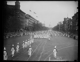The Ku Klux Klan marches down Pennsylvania Ave in Washington, DC. Photograph by Harris & Ewing, 1926.
 