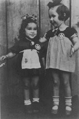 Two young cousins shortly before they were smuggled out of the Kovno ghetto. A Lithuanian family hid the children and both girls survived the war. Kovno, Lithuania, August 1943.