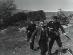 The Ustase were pro-German Croatian fascists. After the Axis invasion and partition of Yugoslavia in April 1941, the Germans established a dependent Croatian state. Led by Ante Pavelic, the Croatian regime began a genocidal campaign against minority groups and killed hundreds of thousands of Serbs and tens of thousands of Jews in Croatia. This possibly staged Ustase footage shows Ustase paramilitary forces rounding up villagers in rural Croatia. In May 1945, Yugoslav partisans under Marshal Tito--with Soviet support--overturned the Croatian regime.