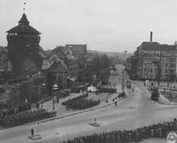 The inhabitants of Nuremberg watch a parade of US troops through their city. Nuremberg, Germany, 1946.