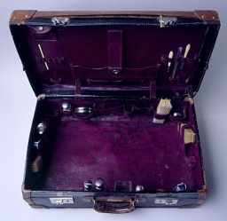 A small group of Jewish refugees left Japan to join a small Jewish community in Harbin, Manchuria, in Japanese-occupied China. This image shows the interior of a leather suitcase carried by one of them to Harbin, China, 1940-1941. [From the USHMM special exhibition Flight and Rescue.]