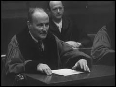 This film clip shows the use of headphones at the International Military Tribunal. English, French, Russian, and German were the official languages of the Nuremberg trials. Translators provided simultaneous translations of the proceedings. Each participant in the trial had a set of headphones.