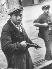Bedukian Sarkis, a French partisan of Armenian extraction, patrols a street along with another partisan during the August 1944 insurrection in the south of France. Marseille, France, August 1944.