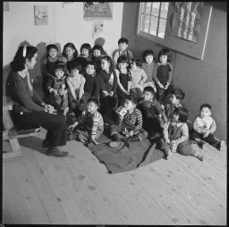 A group of nursery school children at the Heart Mountain Relocation Center in Wyoming, January 4, 1943. The Heart Mountain Relocation Center was one of ten relocation centers where Japanese Americans were forcibly deported.