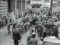 Germany's formal surrender on May 7 and VE-Day (Victory in Europe Day) on May 8, 1945, were marked by joyous celebrations all over Europe. This footage shows streets in Paris and London filled with people celebrating the unconditional Allied victory over Nazi Germany and the winning of the war in Europe.