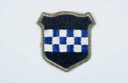 Insignia of the 99th Infantry Division. The 99th Infantry Division, the "Checkerboard" division, gained its nickname from the division's insignia. The insignia was devised upon the 99th's formation in 1942, when the division was headquartered in the city of Pittsburgh. The blue and white checkerboard in the division's insignia is taken from the coat of arms of William Pitt, for whom Pittsburgh is named. The division was also known as the "Battle Babies" during 1945, a sobriquet coined by a United Press correspondent when the division was first mentioned in press reports during the Battle of the Bulge.