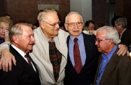 Liberator Vernon Tott (second from left) of the 84th Infantry was honored by some of the survivors he helped free from the Ahlem labor camp near Hanover, Germany. Tott's name was engraved on the Museum's Donor's Lounge wall with the inscription: "In honor of Vernon W. Tott, my liberator & hero." The ceremony in which Tott's name was unveiled came as a complete surprise to him. Washington, DC, November 2003.