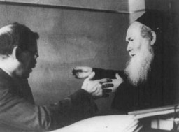 Yitzhak Gitterman (left), Joint Distribution Committee (JDC) director in Warsaw, meets with the representative of an Orthodox Jewish organization. Warsaw, Poland, date uncertain.
