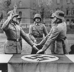 Members of a German military unit swear allegiance to Adolf Hitler. Germany, date uncertain.