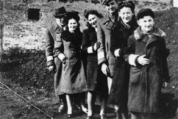 Young Jewish men and women pose for a photograph in the Piotrkow Trybunalski ghetto. Poland, 1940.
Pictured from left to right are: Abram Zarnowiecki, Rozia Zarnowiecki, Mania Freiberger, Moniek, Rachel Zarnowiecki, and Chaim Zarnowiecki.
All those pictured died in the Holocaust. 