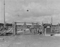 The entrance gate to Kaufering IV subcamp of Dachau. This photograph was taken after liberation. Near Landsberg, Germany, after April 28, 1945.