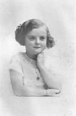 Photograph of seven-year-old Jacqueline Morgenstern in Paris, France, 1940. Jacqueline was later a victim of tuberculosis medical experiments at the Neuengamme concentration camp. The SS took 20 of the children who had been victims of medical experiments at Neuengamme to a school building in Hamburg. Situated on Bullenhuser Damm, this location was a subcamp of Neuengamme. Jacqueline and the other children in the group (10 boys and 10 girls, all Jewish) were killed there.
