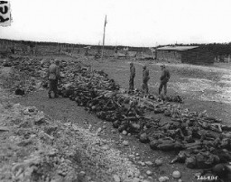 US troops view bodies of victims of Kaufering IV, a Dachau subcamp in the Landsberg-Kaufering area. Germany, April 30, 1945.