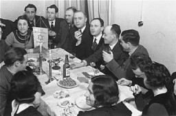 Members of the Chug Ivri (Hebrew Club) in Berlin enjoy a festive meal in celebration of Purim. Berlin, Germany, 1935.