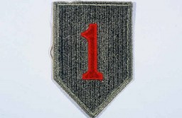 Insignia of the 1st Infantry Division. The 1st Infantry Division's nickname, the "Big Red One," originated from the division's insignia, a large red number "1" on a khaki field. This nickname was adopted during World War I, when the 1st was the first American division to arrive in France.