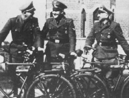 Three SS officers at the Breendonk internment camp: from left, First Lieutenant Hans Kantschuster, Master Sergeant Walter Mueller, and Second Lieutenant Artur Prauss. Breendonk, Belgium, between 1940 and 1944.
