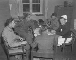 War crimes investigators interrogate chief nurse Irmgard Huber in connection with mass killings at the Hadamar Institute, one of main facilities in the Nazi Euthanasia Program. Hadamar, Germany, May 1945.