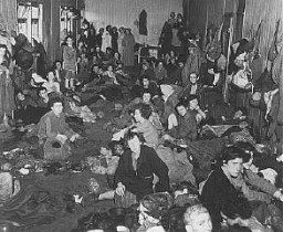 Romani (Gypsy) survivors in a barracks of the Bergen-Belsen concentration camp during liberation. Germany, after April 15, 1945.