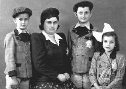 Portrait of members of a Hungarian Jewish family. They were deported to and killed in Auschwitz soon after this photo was taken. Kapuvar, Hungary, June 8, 1944.
