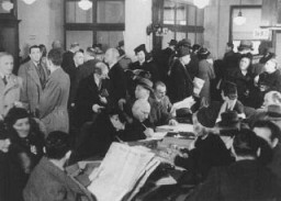 German Jews crowd the Palestine Emigration Office in an attempt to leave Germany. Berlin, Germany, 1935.