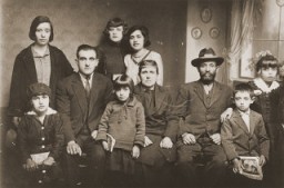Portrait of the family of Mushon and Rebeka Kamchi in Bitola. Isak Kamchi is pictured in the front row at the right. Isak was born in Bitola. Several of his siblings and cousins left Macedonia for Palestine and North America before the war. During World War II, Isak served as the leader of a partisan unit operating in Croatia. He established a safehouse at his parent's home in Zagreb where partisans could rest and recuperate. His mother ran the safehouse, cooking for the men and nursing them back to health. When the Germans discovered the safehouse, they offered Isak protection in exchange for his surrender. However, when he did surrender, he was arrested and later killed. He may have been publicly hanged. Photograph taken in Bitola, ca. 1932.