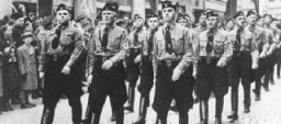 Members of the Hlinka Guard and a squad of ethnic Germans march during a parade in Slovakia, a Nazi satellite state. Date uncertain.