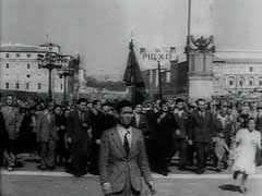 After Italy's armistice with the Allies in September 1943, the Italian army disintegrated. The country was divided between German forces holding the northern and central regions (including Rome) and Allied forces in the south. After nine months of bitter combat, Allied forces—specifically the US Fifth Army—liberated Rome in June 1944. This footage shows scenes of celebration as troops move through Rome. It ends with a prayer by Pius XII (pope, 1939–1958).