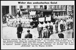 A newspaper clipping with the headline "Against the Un-German Spirit" announces the plundering of the Institute for Sexual Science. The photo shows students marching to the institute's entrance before the looting began on May 6, 1933. The institute's books and documents were among those targeted during the Nazi book burnings. 