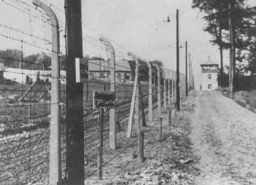 View of a guard tower and fence at the Buchenwald concentration camp. Germany, wartime.