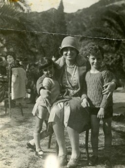 Terese Cohen, a Tunisian Jewish women, poses with her two children, Nadia and Marcel.
Immediately after the Allied landings in Algeria and Morocco, the Germans occupied Tunisia. After the occupation, an SS officer came to the Cohen's house and confiscated everything leaving only the table and chairs for the Germans to use. They gave the family 24 hours to pack and leave and then expropriated the home to use as a barracks for soldiers.