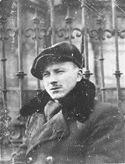Benjamin Miedzyrzecki (Benjamin Meed), a member of the Jewish underground living in hiding on false papers, poses in Ogrod Saski (Saski Gardens) on the Aryan side of Warsaw. Poland, 1943.
