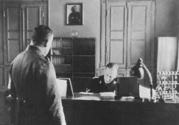 SS General Reinhard Heydrich in his office during his tenure as Bavarian police chief. Munich, Germany, April 11, 1934.