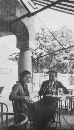Photograph of Esther Lurie and a friend, Jose, who were both students at the Institute of Art in Brussels. Here they are enjoying refreshments on an outdoor terrace in the early 1930s. Lurie would later flee Europe as war became imminent. Brussels, Belgium, 1931–1933. 