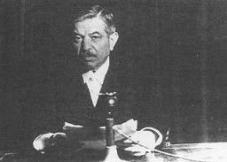 Pierre Laval, head of the government of Vichy France and Nazi collaborator. Shown here delivering a radio address. France, 1941–42.